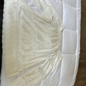 Elegant Cream long sleeve top with lace design!